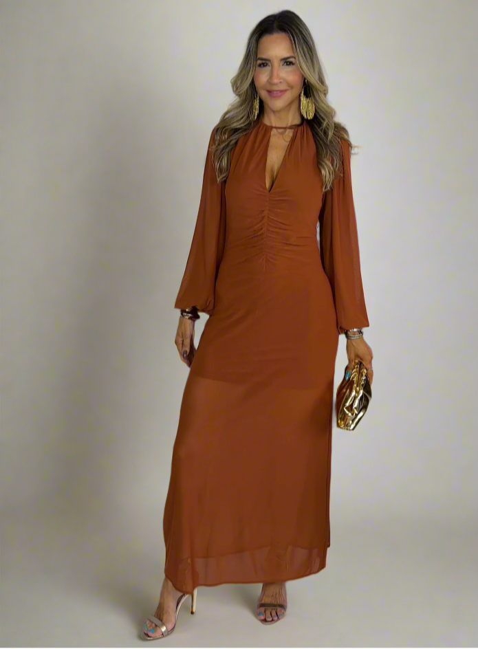 Woman wearing a brown dress with a white background