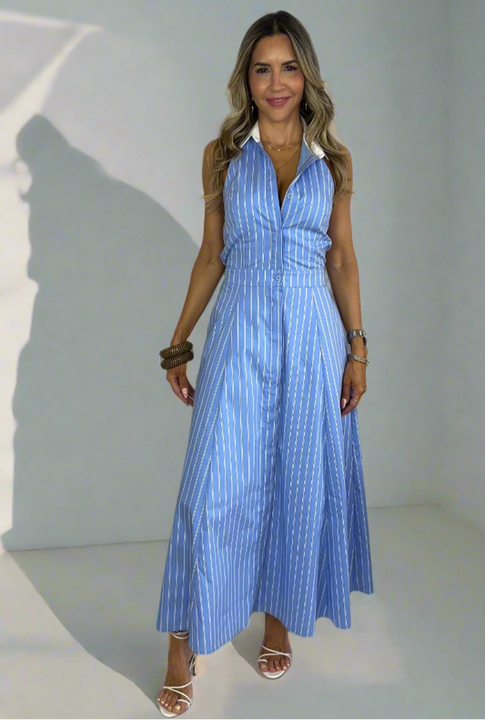 Woman wearing a blue dress against a white background