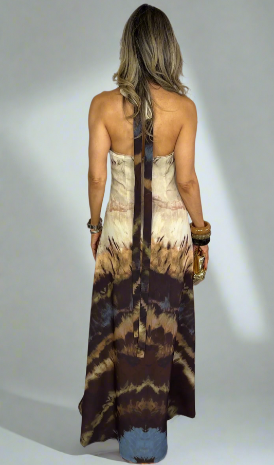 Woman wearing a tie-dye dress with a white background